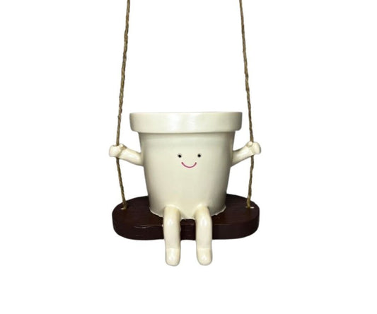 Macetero Columpio Redondo - forma esférica con carita sonriente colgado en columpio